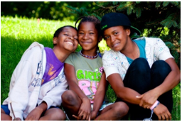 Three children smiling